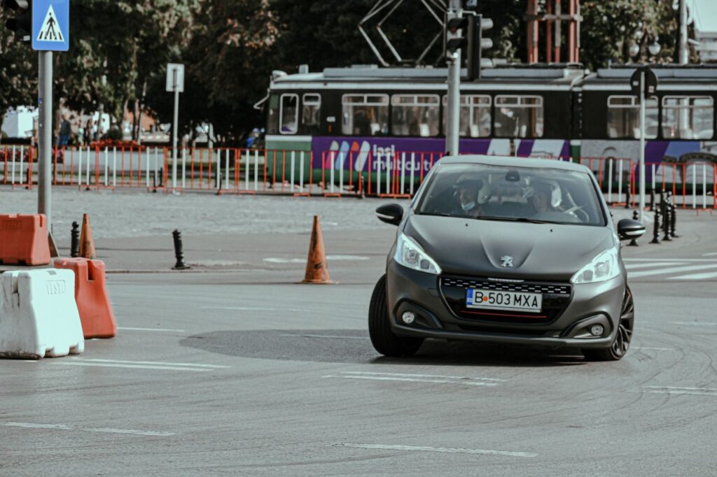 Mastering the First Impression: Your intriguing post title goes here Black car driving fast while drifting in turn on asphalt roadway in city